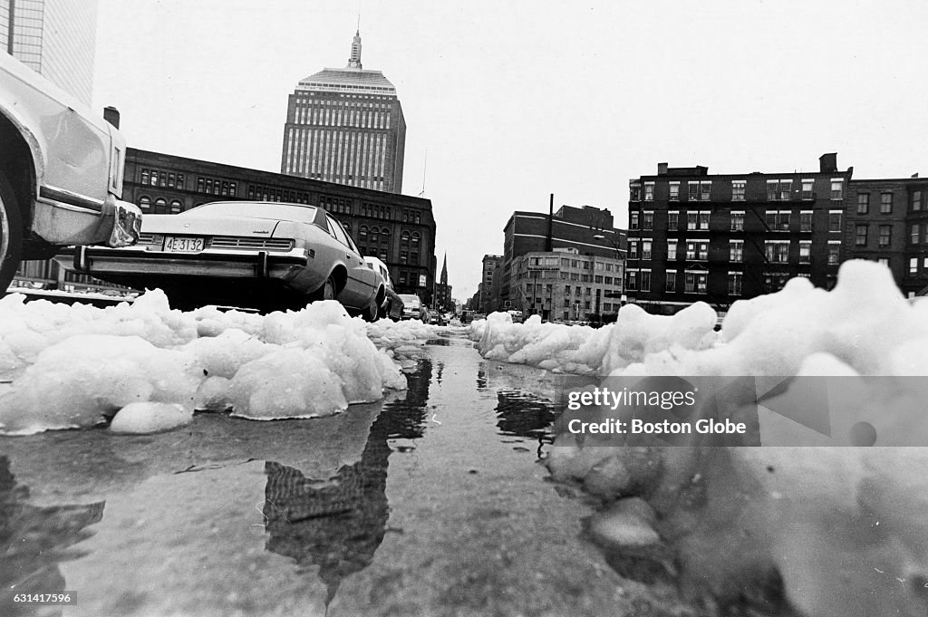 Boston Slush Puddles form on Berkeley Street at Columbus Avenue in Boston as slush ...