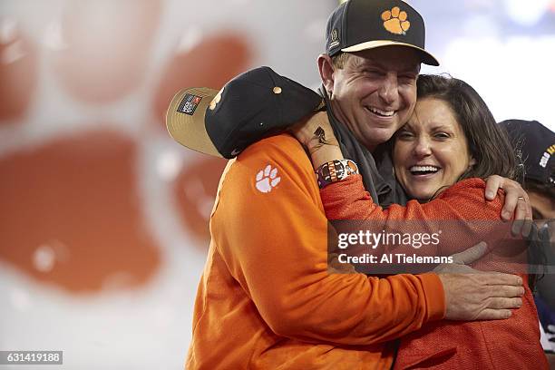 Playoff National Championship: Clemson coach Dabo Swinney victorious with wife Kathleen after winning game vs Alabama at Raymond James Stadium....