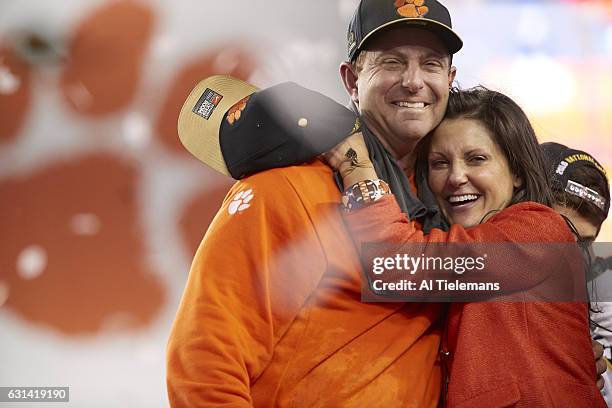 Playoff National Championship: Clemson coach Dabo Swinney victorious with wife Kathleen after winning game vs Alabama at Raymond James Stadium....