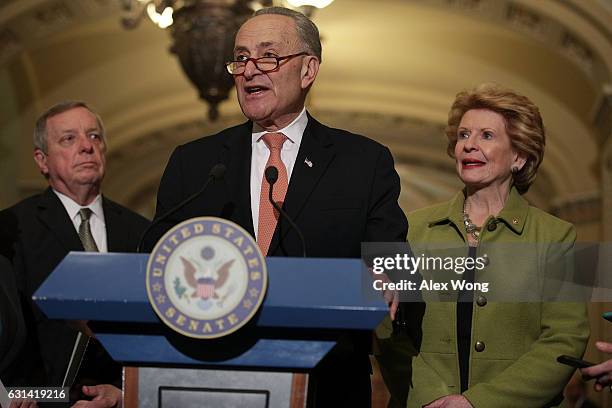 Senate Minority Leader Sen. Charles Schumer speaks as Senate Minority Whip Sen. Richard Durbin and Sen. Debbie Stabenow listen during a news briefing...