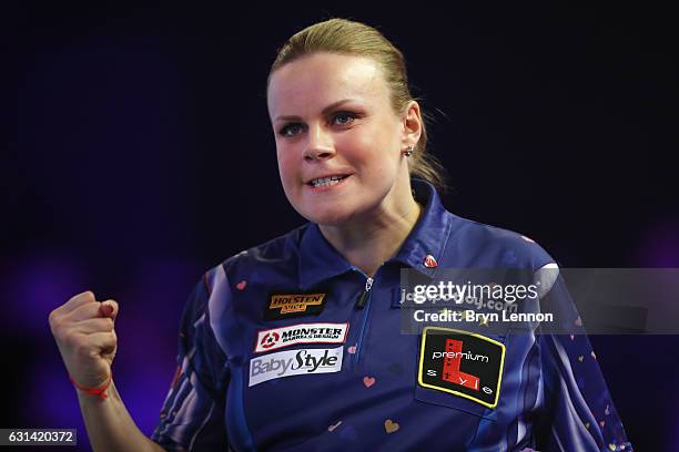 Anastasia Dobromyslova of Russia celebrates during her first round match against on day four of the BDO Lakeside World Professional Darts...