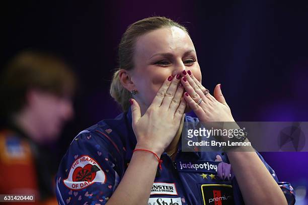 Anastasia Dobromyslova of Russia celebrates during her first round match against on day four of the BDO Lakeside World Professional Darts...
