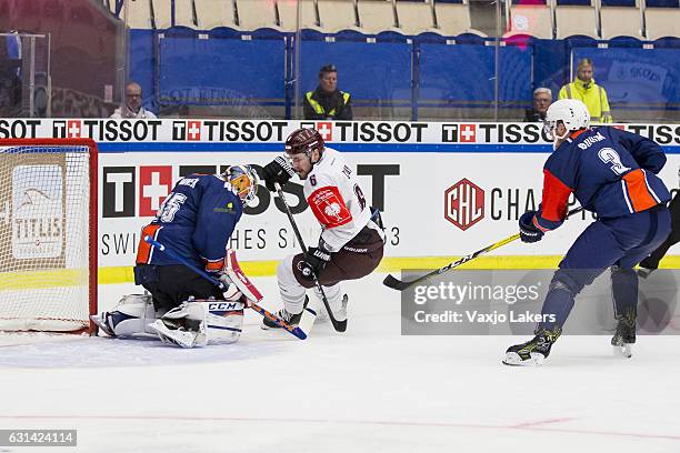 Viktor Andran Goaltender of Vaxjo Lakers makes a save during the Champions Hockey League Semi Final match between Vaxjo Lakers and Sparta Prague at...