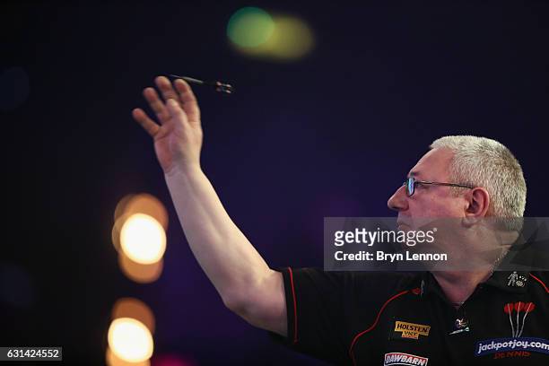 Dennis Harbour of Great Britain in action during his first round match on day four of the BDO Lakeside World Professional Darts Championships on...