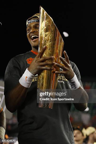 Clemson Tigers quarterback Deshaun Watson holds the National Championship Trophy after the 2017 College Football National Championship Game between...