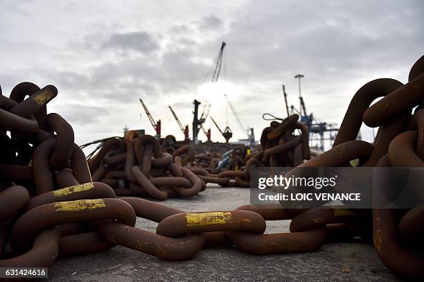 Huge chains used to moor an offshore floating wind turbine prototype are seen on January 10, 2017 in Saint-Nazaire, western France. AFP PHOTO / LOIC...