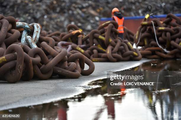 Huge chains used to moor an offshore floating wind turbine prototype are seen on January 10, 2017 in Saint-Nazaire, western France. AFP PHOTO / LOIC...