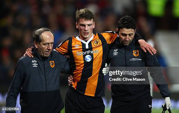 Josh Tymon of Hull City leaves the pitch following an injury during the EFL Cup Semi-Final First Leg match between Manchester United and Hull City at...