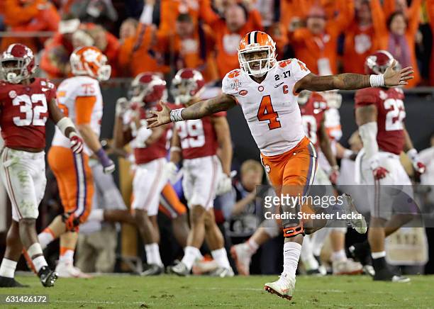 Deshaun Watson of the Clemson Tigers celebrates after throwing a 2-yard game-winning touchdown pass during the fourth quarter against the Alabama...