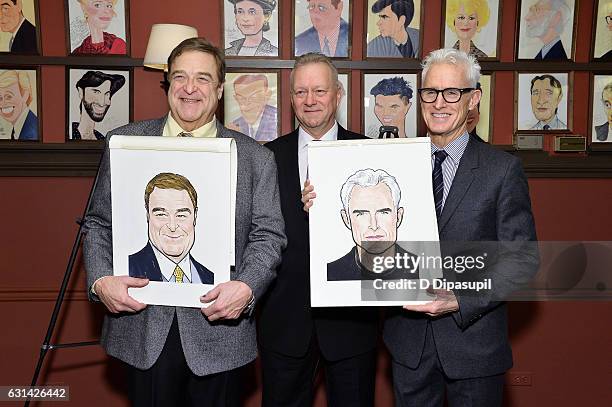 Sardi's owner Max Klimavicius poses with John Goodman and John Slattery during their caricature unveiling at Sardi's on January 10, 2017 in New York...