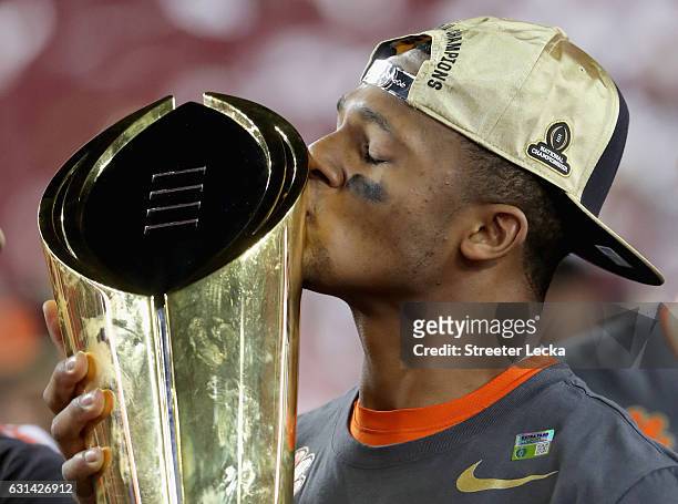 Deshaun Watson of the Clemson Tigers celebrates with the trophy after defeating the Alabama Crimson Tide to win the 2017 College Football Playoff...