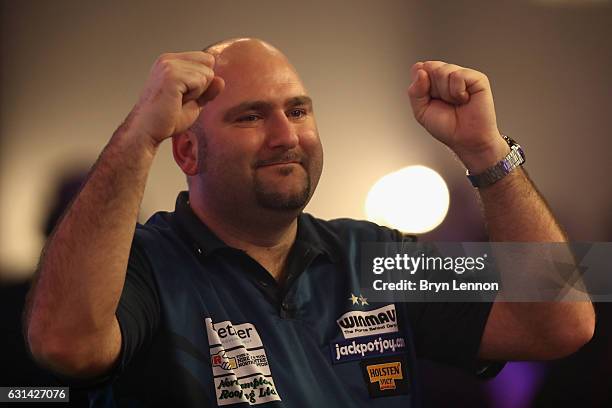 Scott Waites of Great Britain celebrates winning his first round match on day four of the BDO Lakeside World Professional Darts Championships on...