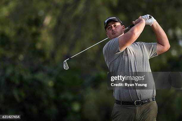 Michael Putnam tees off on the ninth hole during the third round of The Bahamas Great Exuma Classic at Sandals - Emerald Bay Course on January 10,...