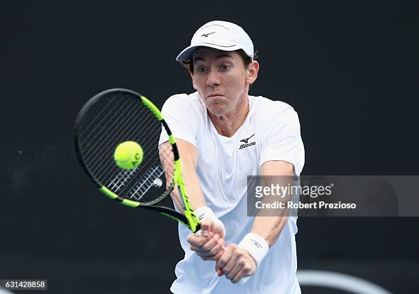 John-Patrick Smith of Australia plays a backhand in his 2017 Australian Open Qualifying match against Agustin Velotti of Argentina at Melbourne Park...