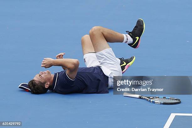 Andrew Whittington of Australia rolls his ankle in his match against Mikhail Youzhny of Russia during day two of the 2017 Priceline Pharmacy Classic...