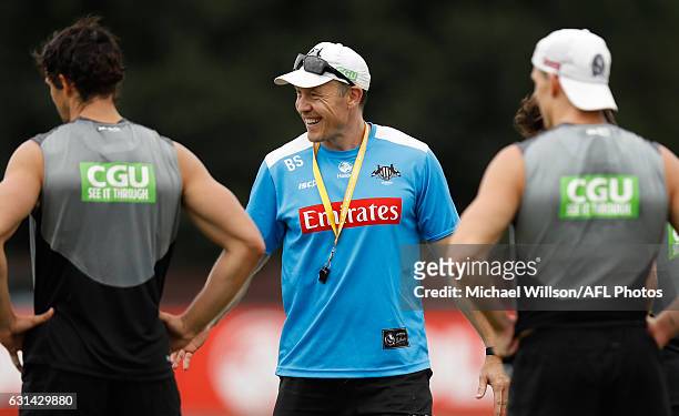 Brenton Sanderson, Assistant Coach of the Magpies addresses players during the Collingwood Magpies training session at Olympic Park Oval on January...