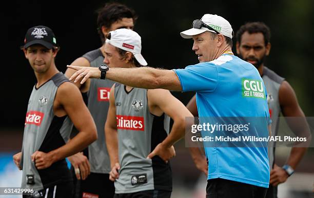 Brenton Sanderson, Assistant Coach of the Magpies addresses players during the Collingwood Magpies training session at Olympic Park Oval on January...