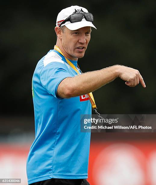 Brenton Sanderson, Assistant Coach of the Magpies addresses players during the Collingwood Magpies training session at Olympic Park Oval on January...