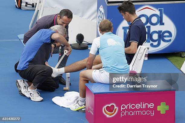 Andrew Whittington of Australia takes a mediacal time out in his match against Mikhail Youzhny of Russia during day two of the 2017 Priceline...