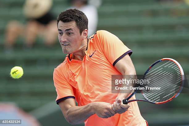 Bernard Tomic of Australia plays a backhand shot in his match against David Goffin of Belgium during day two of the 2017 Priceline Pharmacy Classic...