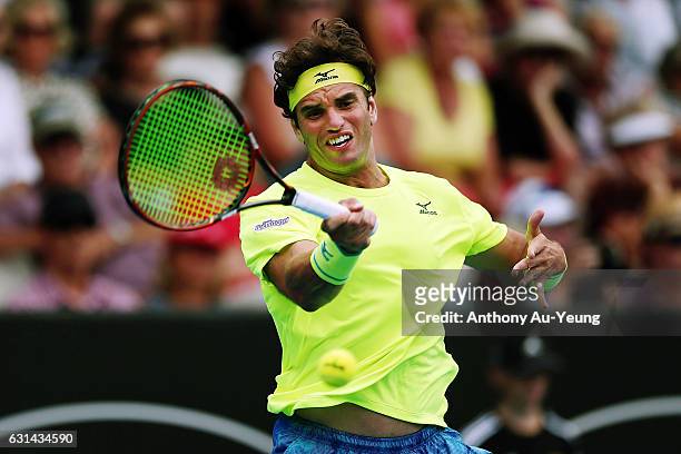 Malek Jaziri of Tunisia plays a forehand in his match against John Isner of USA on day ten of the ASB Classic on January 11, 2017 in Auckland, New...