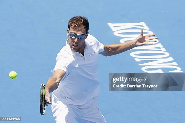 Jerzy Janowicz of Poland plays a backhand shot in his match against Yoshihito Nishioka of Japan during day two of the 2017 Priceline Pharmacy Classic...