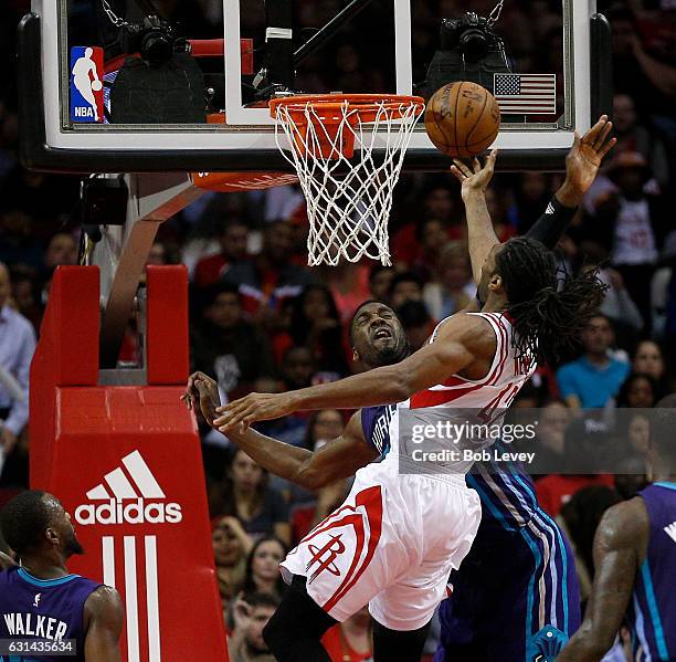 Nene of the Houston Rockets drives to the basket as Roy Hibbert of the Charlotte Hornets attemptss to block his shot at Toyota Center on January 10,...