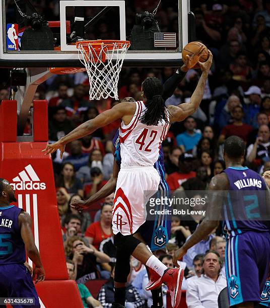 Nene of the Houston Rockets drives to the basket as Roy Hibbert of the Charlotte Hornets attemptss to block his shot at Toyota Center on January 10,...