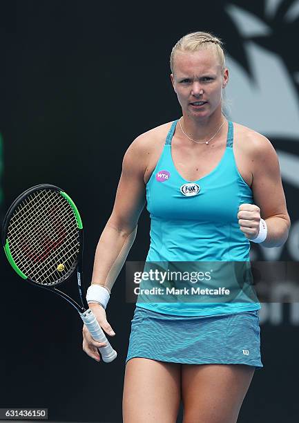 Kiki Bertens of the Netherlands celebrates winning match point in her second round match against Galina Voskoboeva of Kazakhstan during day two of...