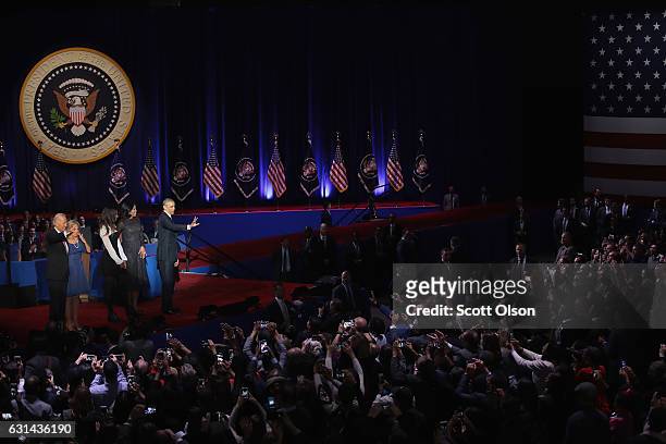 President Barack Obama, his wife Michelle and daughter Malia, and Vice President Joe Biden and his wife Jill greet guest following Obama's farewell...