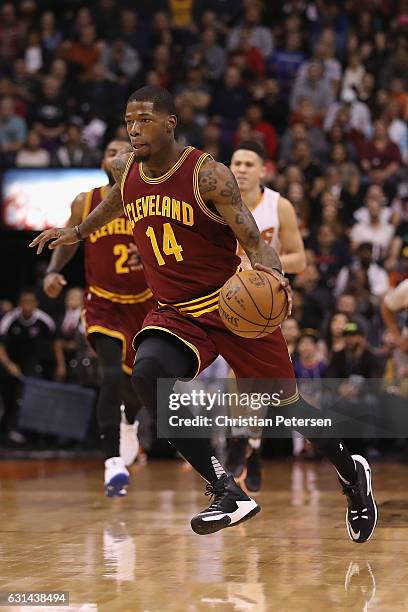 DeAndre Liggins of the Cleveland Cavaliers handles the ball during the first half of the NBA game against the Phoenix Suns at Talking Stick Resort...