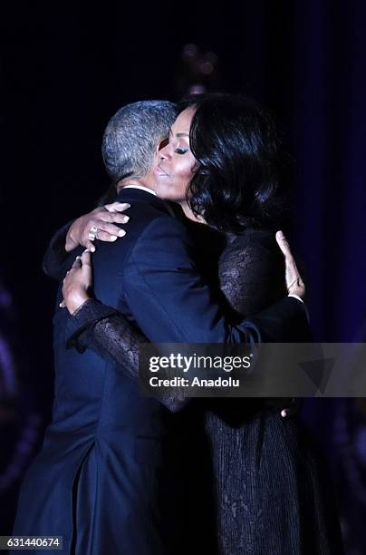 President Barack Obama greets daughter Malia and first lady Michelle Obama on stage after delivering his farewell address at the McCormick Place, the...