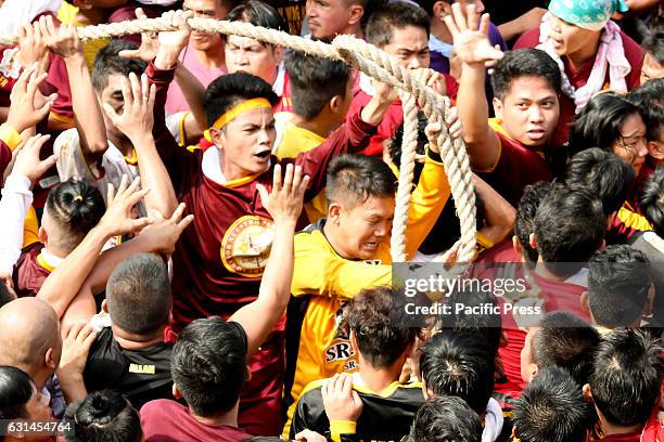 Devotees jostle among themselves to be able to, even just briefly, touch the abacca rope pulling the andas of the Black Nazarene. By pulling on the...