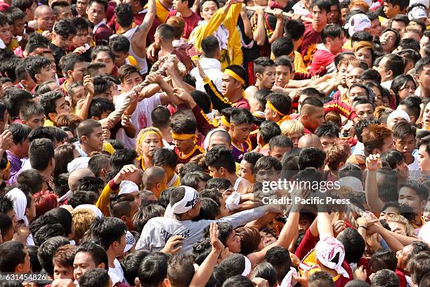 Devotees jostle among themselves to be able to, even just briefly, touch the abacca rope pulling the andas of the Black Nazarene. By pulling on the...