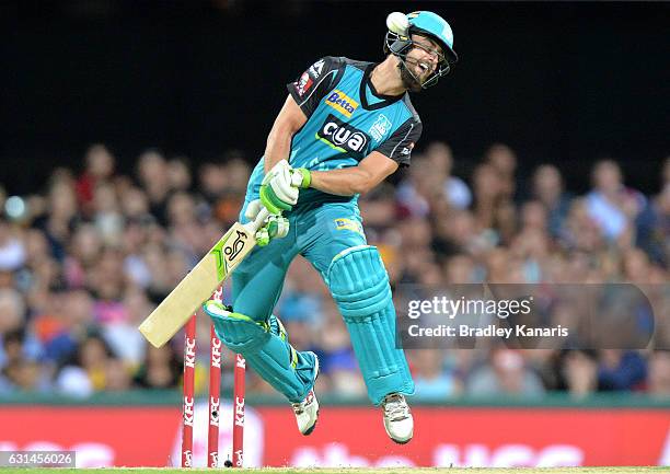 Alex Ross of the Heat attempts to move out of the way of a bouncer bowled by Mitchell Johnson of the Scorchers during the Big Bash League match...