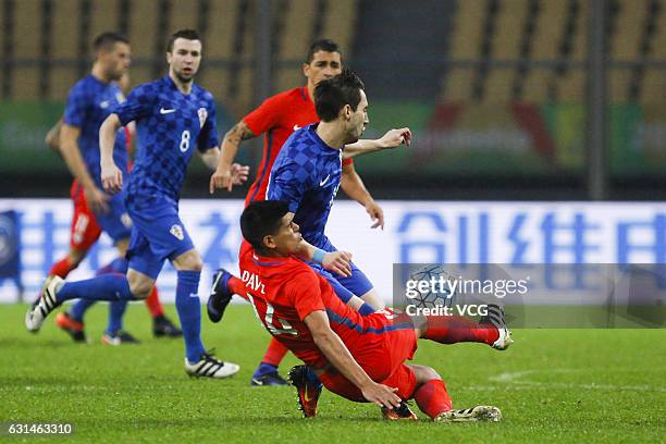 Esteban Pavez of Chile falls down during the semi-final match of 2017 Gree China Cup International Football Championship between Croatia and Chile at...