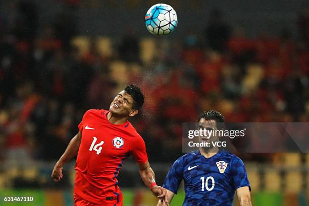 Esteban Pavez of Chile and Franko Andrijasevic of Croatia vie for the ball during the semi-final match of 2017 Gree China Cup International Football...