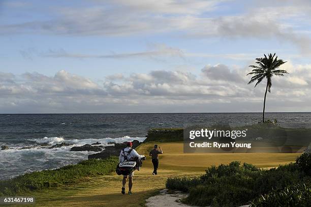 Anders Albertson walks up the 13th hole tees off on the 13th hole during the continuation of the third round of The Bahamas Great Exuma Classic at...