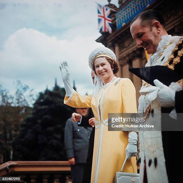 Queen Elizabeth II visits the Town Hall in Sydney with Emmet McDermott , Lord Mayor of Sydney, during her tour of Australia, May 1970. She is there...