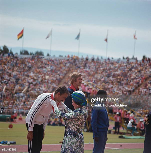 Queen Elizabeth II presents the medals to the winners at the Commonwealth Games in Christchurch, New Zealand, February 1974.