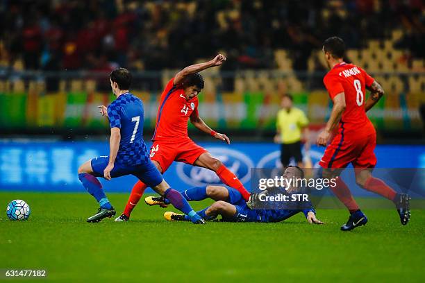 Esteban Pavez of Chile fights for the ball with Josip Pivaric of Croatia during a 2017 Gree China Cup International Football Championship group match...