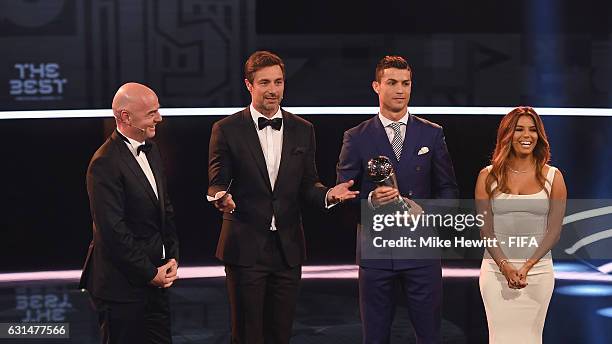 The Best FIFA Men's Player Award winner Cristiano Ronaldo of Portugal and Real Madrid poses with FIFA President Gianni Infantino and presenters Marco...