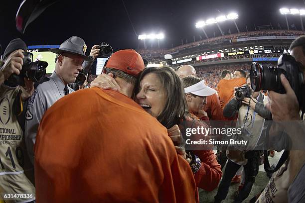 Playoff National Championship: Clemson coach Dabo Swinney victorious with wife Kathleen after winning game vs Alabama at Raymond James Stadium....