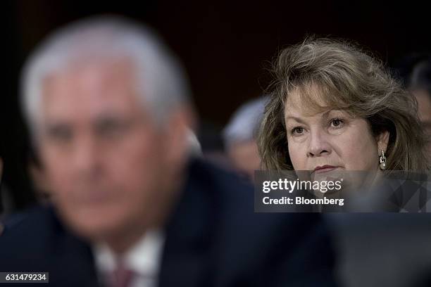 Renda St. Clair listens as her husband Rex Tillerson, former chief executive officer of Exxon Mobil Corp. And U.S. Secretary of state nominee for...