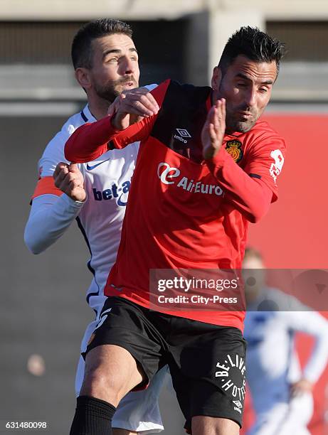 Vedad Ibisevic of Hertha BSC and Juan Rodriguez of RCD Mallorca during the test match between RCD Mallorca against Hertha BSC on January 11, 2017 in...