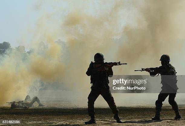 Indian army commandos take part in a surgical strike mock operation , on the second day of the 'Know your army exhibition' in Allahabad on January...