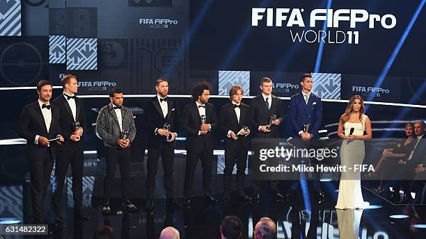 Members of the FIFA FIFPro World11 appear on stage with hosts Eva Longoria and Marco Schreyl during The Best FIFA Football Awards at TPC Studio on...