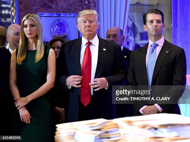 President- elect Donald Trump stands with his children Ivanka and Donald Jr., during Trump's press conference at Trump Tower in New York on January...