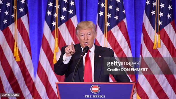 President-elect Donald Trump adresses a CNN journalist and refuses toanswer his question during a press conference on January 11, 2017 in New York....