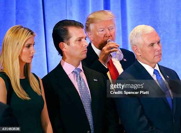 President-elect Donald Trump stands with Vice President-elect Mike Pence, Trump's son Donald Trump Jr. And his daughter Ivanka at a news conference...